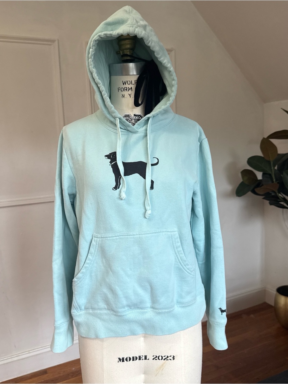 The Black Dog Light Blue Pullover Hoodie with Black Dog Graphic